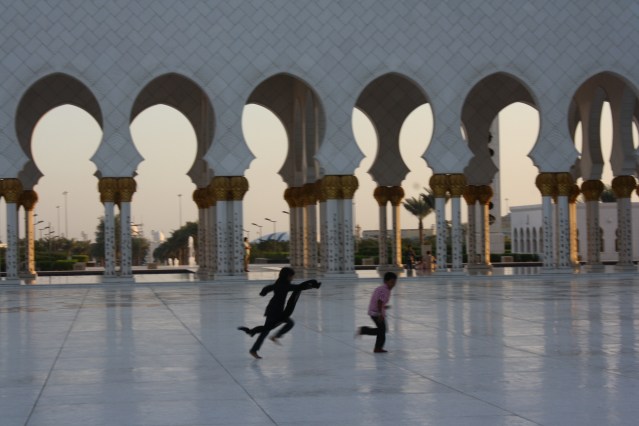 children running in mosque